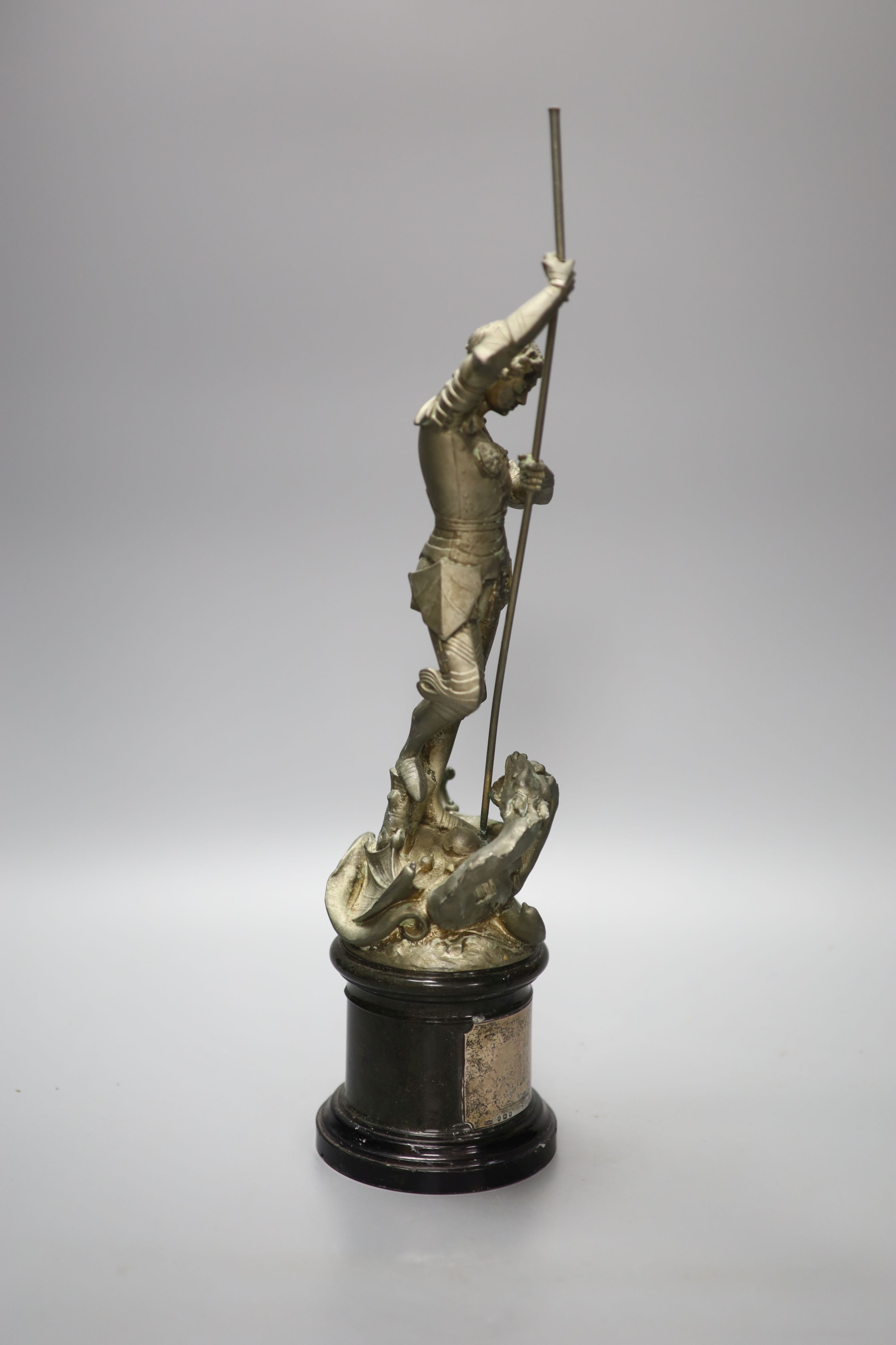 A spelter figure of St George and the Dragon, on turned marble base with vacant silver cartouche, height 41cm